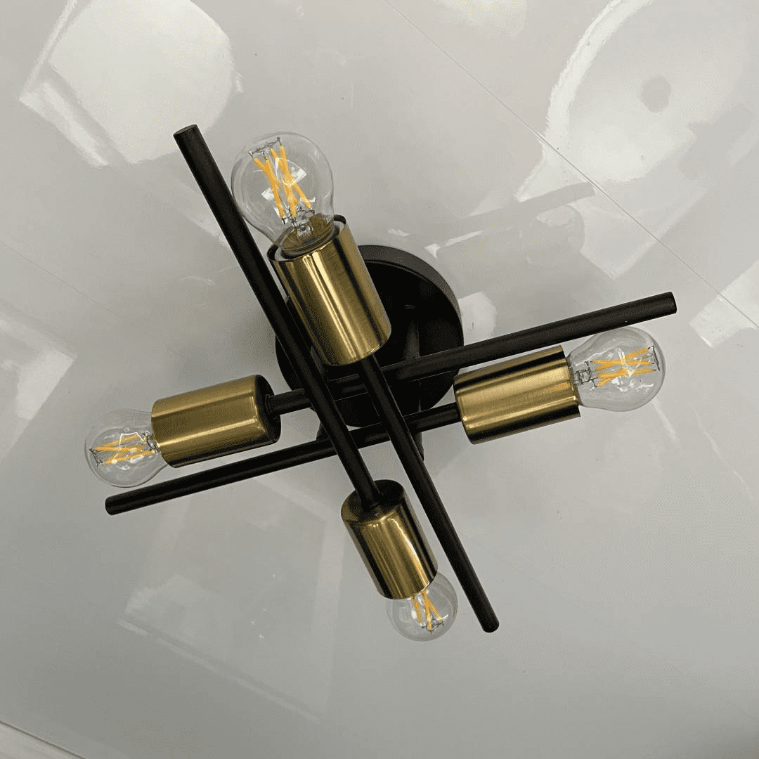 Close up photo of masculine light fixture in mens restroom trailer suite