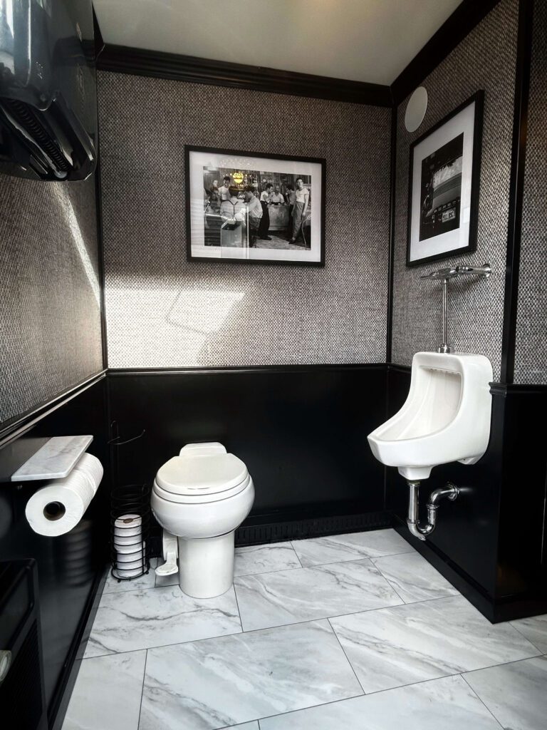 Homepage 6 Wide interior view of luxury mobile restroom trailer bathroom for weddings and events