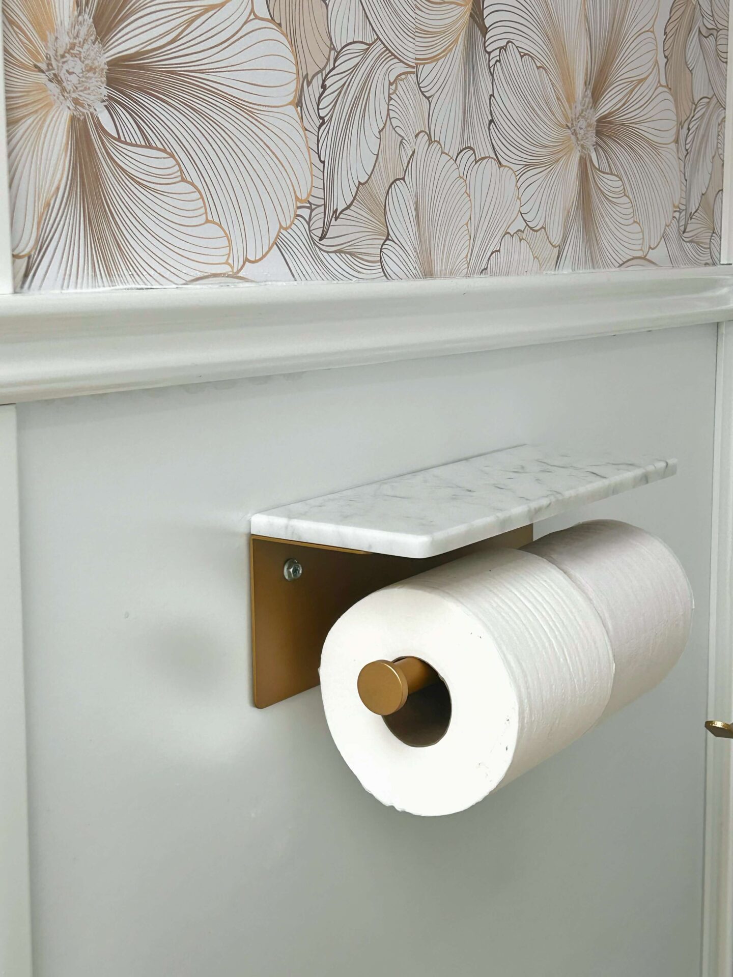 Toilet paper holder detail inside a luxury restroom trailer bathroom