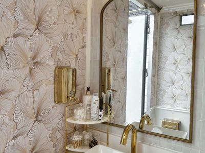 Elegant vanity with gold mirror inside a luxury mobile restroom trailer by Toiluxe in Ontario