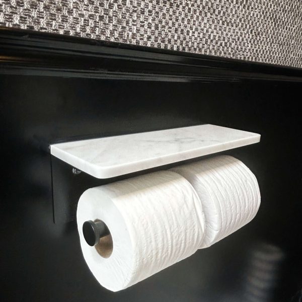 Black toilet paper holder detail inside luxury restroom trailer washroom