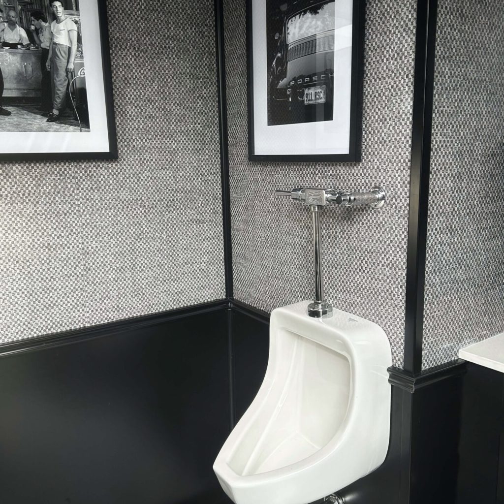 Men's urinal inside a luxury restroom trailer bathroom for events